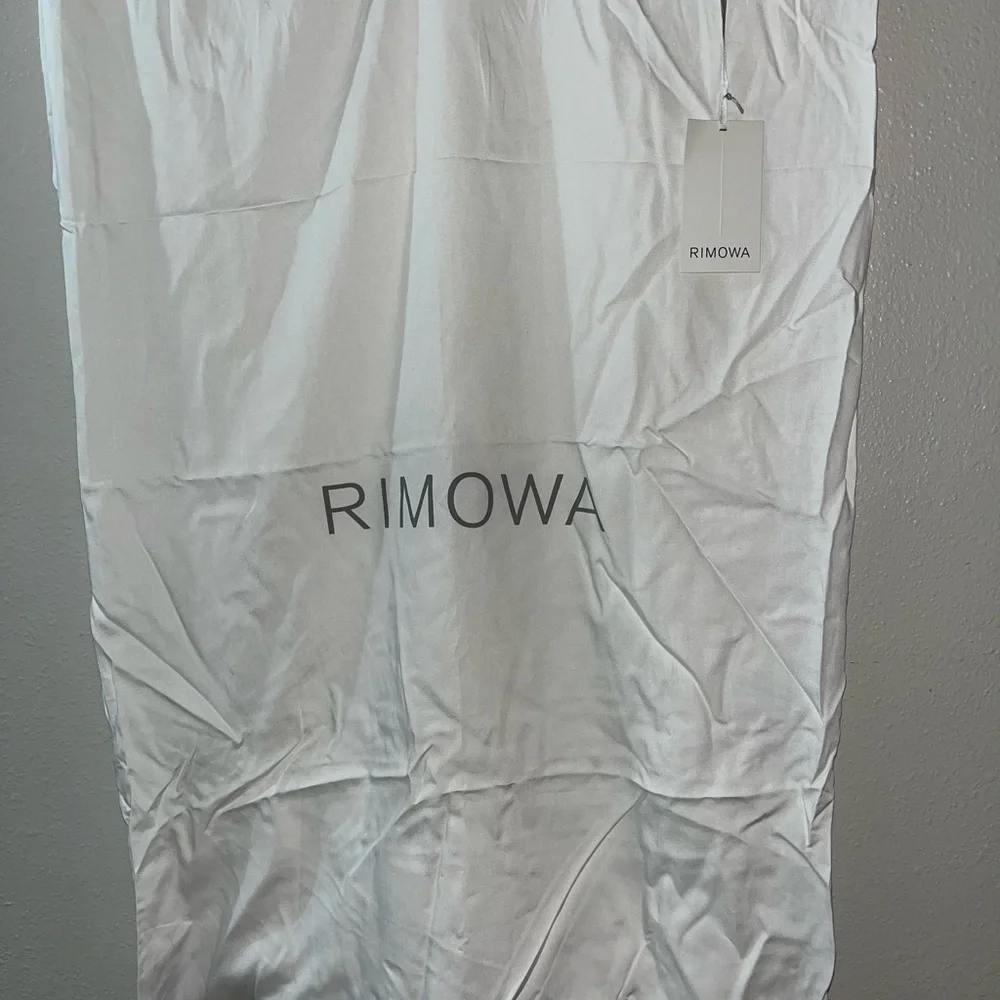 AVAILABLE July 17th    RIMOWA White Protective Luggage Cover with Tag - Picture 6 of 10